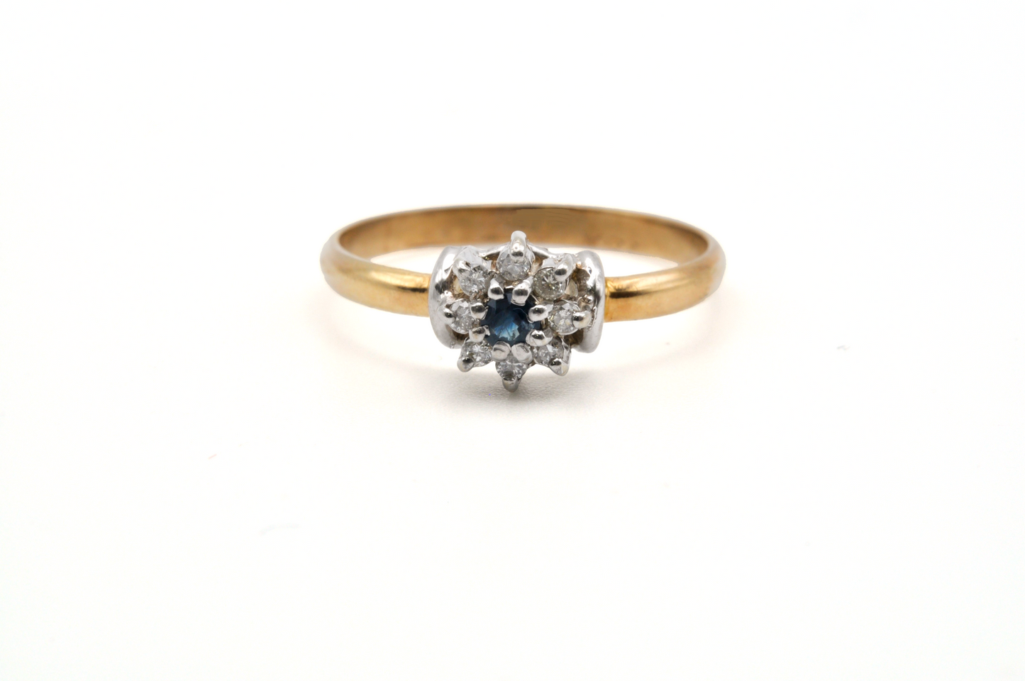 Yellow Gold Ring with Diamonds Surrounding a Blue Sapphire Center Stone