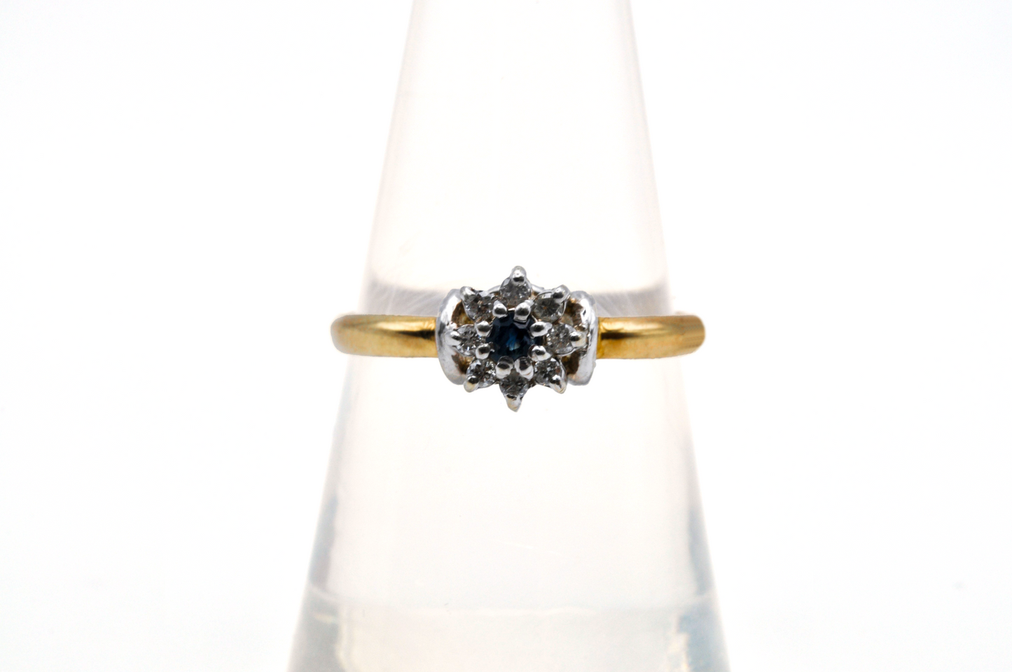 Yellow Gold Ring with Diamonds Surrounding a Blue Sapphire Center Stone