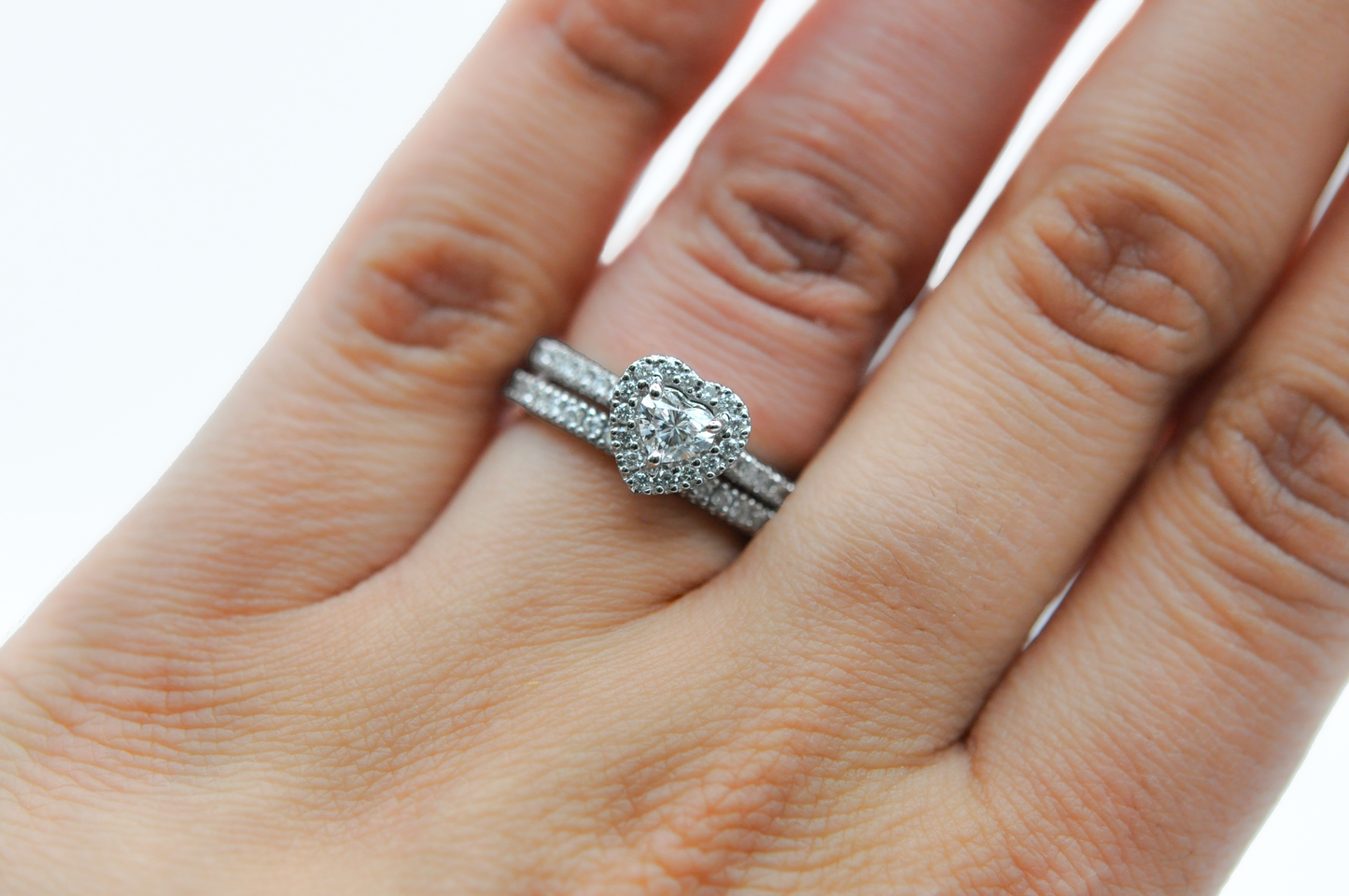 White Gold Heart Diamond with a Halo Engagement Ring and a Pave Diamond Wedding Band