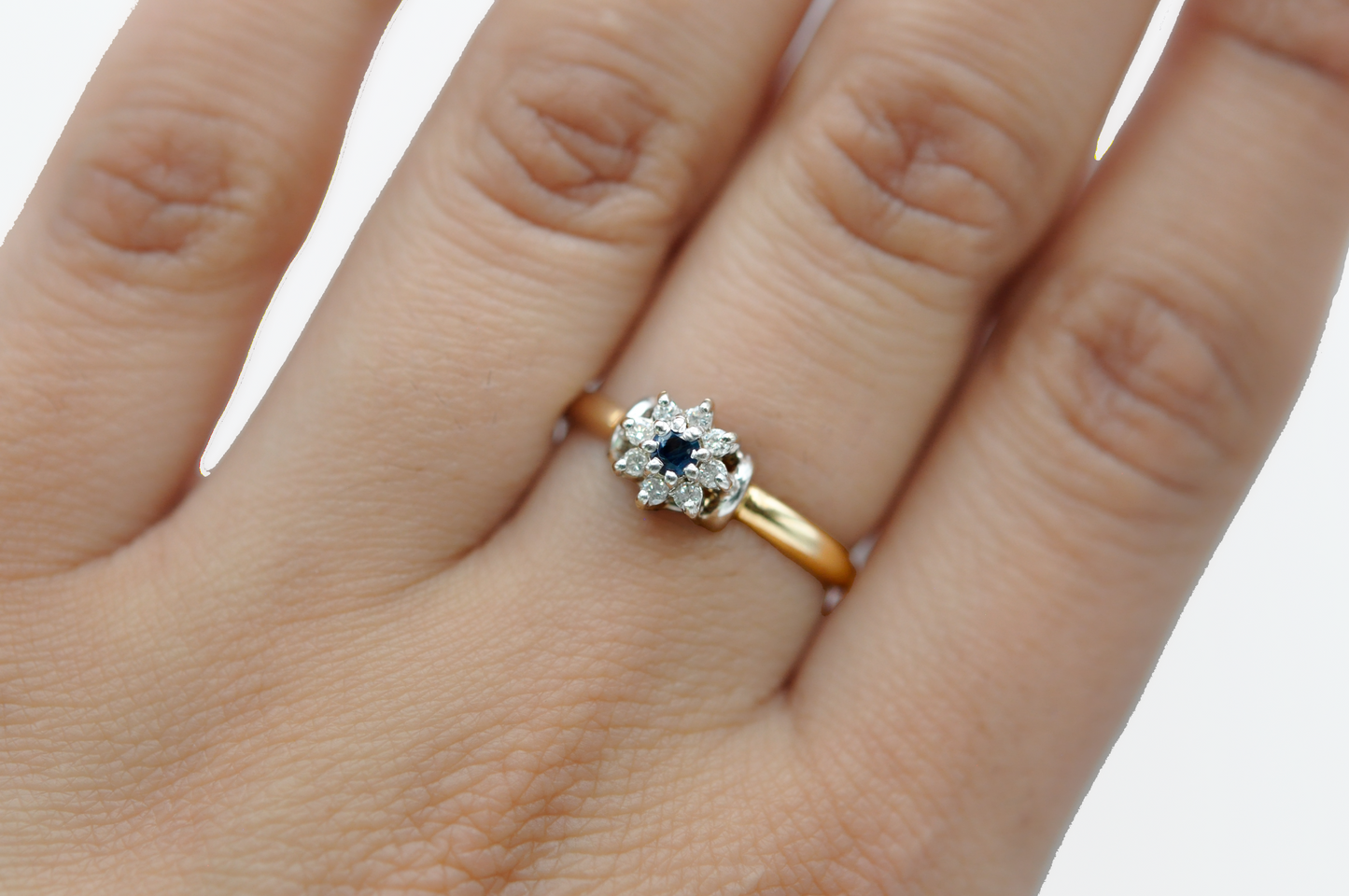 Yellow Gold Ring with Diamonds Surrounding a Blue Sapphire Center Stone